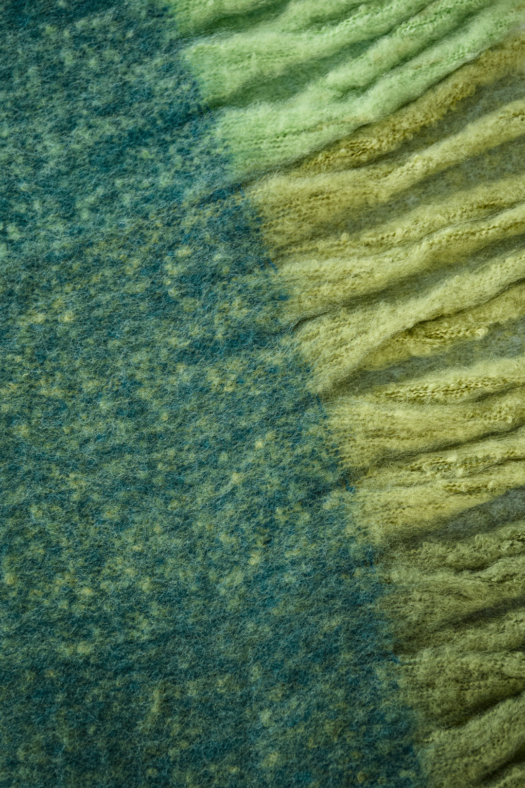 Close-up of the Bria scarf in green and yellow gradient tones showing soft woven texture from Sorea Fashion.