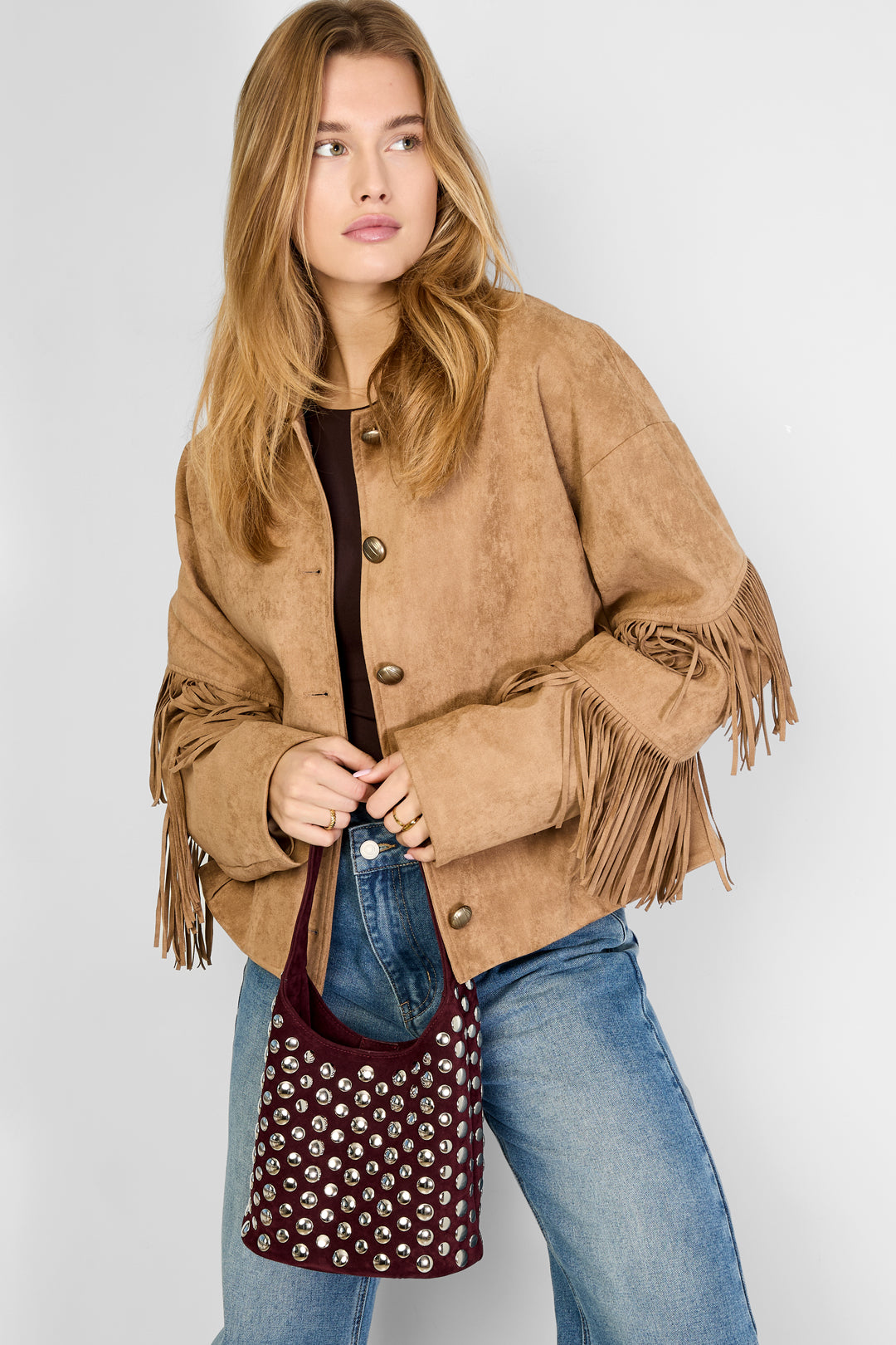 Beige Raen bag with a woven textured design styled in an everyday look from Sorea Fashion.