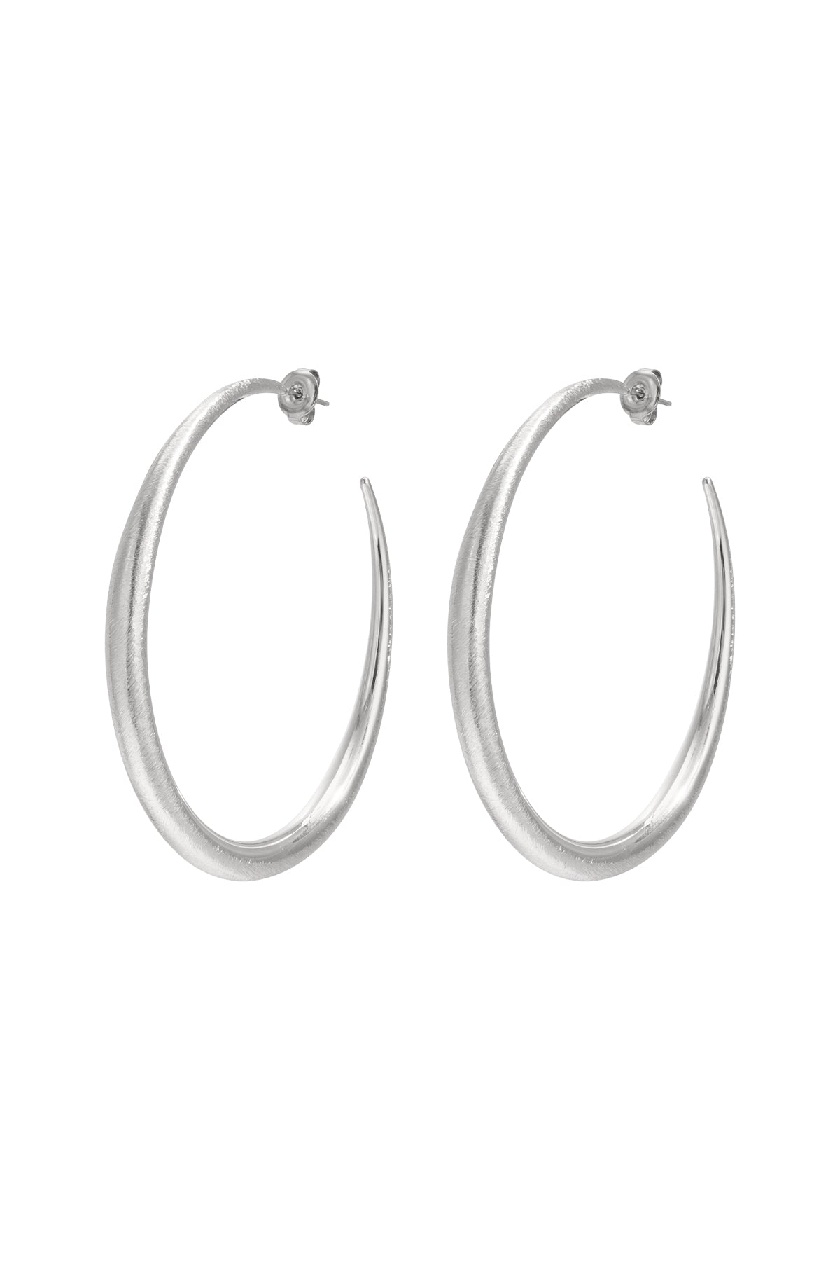 Silver Elena oval hoop earrings with a thick polished shape displayed on a white background from Sorea Fashion.