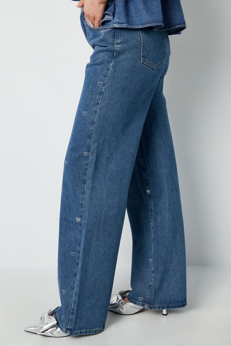 Model styled in the embellished Elys Jeans Sorea Fashion paired with a casual top.