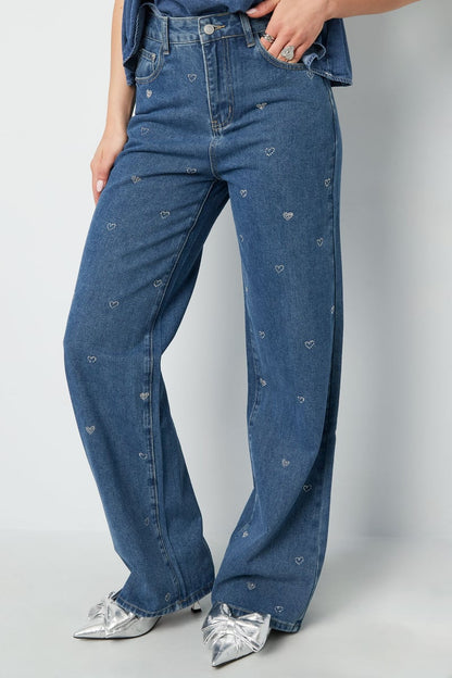 Elys Jeans Sorea Fashion denim jeans with glitter heart detail displayed front-facing.