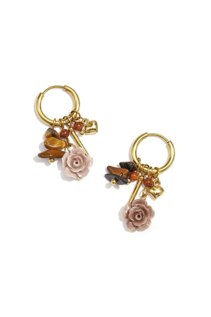 Gold Faye earrings featuring a red gemstone drop displayed on a white background from Sorea Fashion.