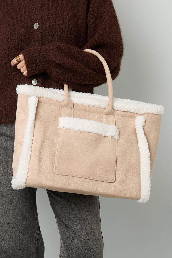 Beige tote bag with a structured minimalist design shown in a styled outfit, Layla bag by Sorea Fashion.