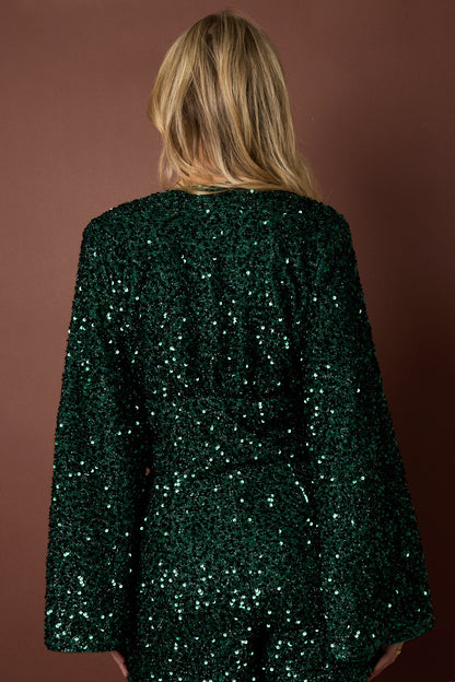 Dark green Livia long sleeve top with a fitted design styled in an outfit from Sorea Fashion.