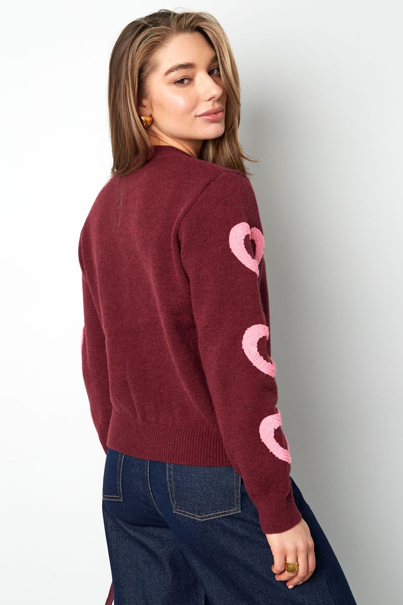 Model wearing the cozy Urie Sweater Sorea Fashion in a soft textured knit.